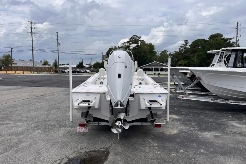 Slide: The Image of 2027 Tidewater 2500 Carolina Bay boat on trailer, rear view, overcast sky. - 3