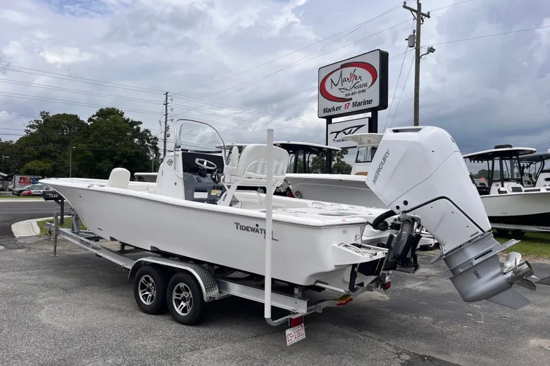 Slide: The Image of 2027 Tidewater 2500 Carolina Bay boat on trailer at Marker 17 Marine dealership. - 2