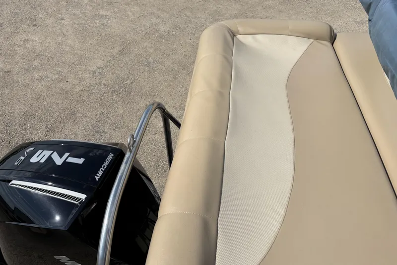 Slide: The Image of South Bay 23 boat with Mercury engine, beige seating, 2006 model. - 19