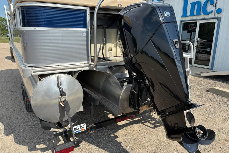 Slide: The Image of Rear view of a 2006 South Bay 23 pontoon boat with an outboard motor. - 2