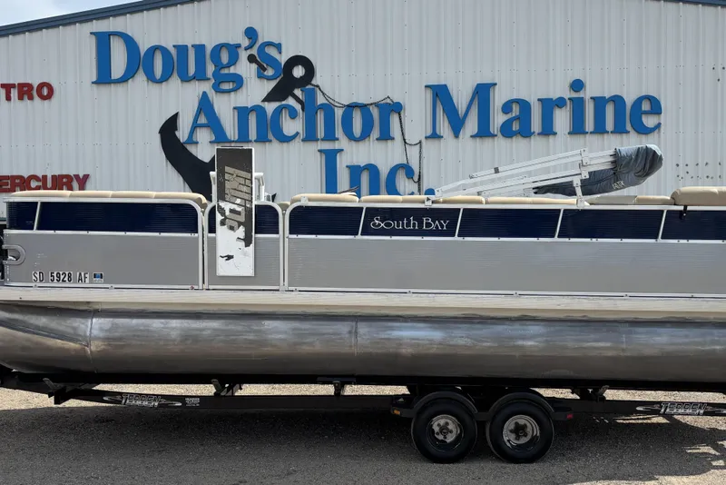 Slide: The Image of 2006 South Bay 23 pontoon boat at Doug's Anchor Marine dealership. - 0