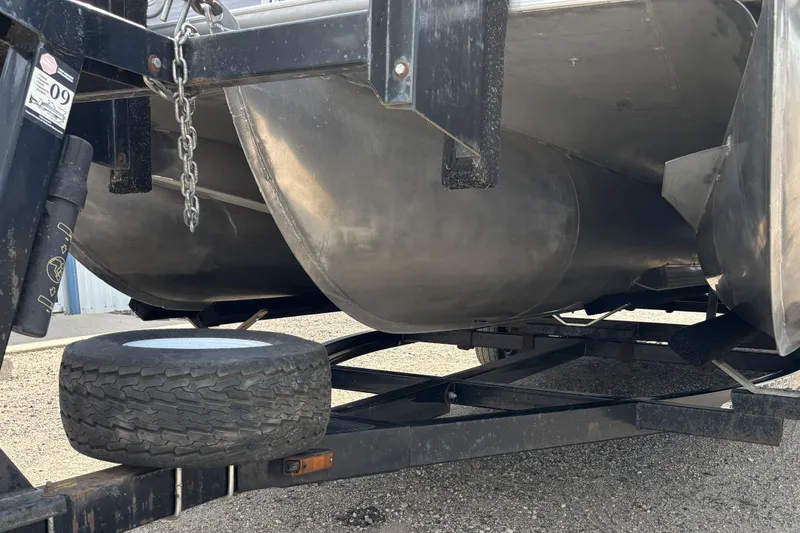 Slide: The Image of Underneath view of a 2006 South Bay 23 pontoon boat on a trailer. - 12