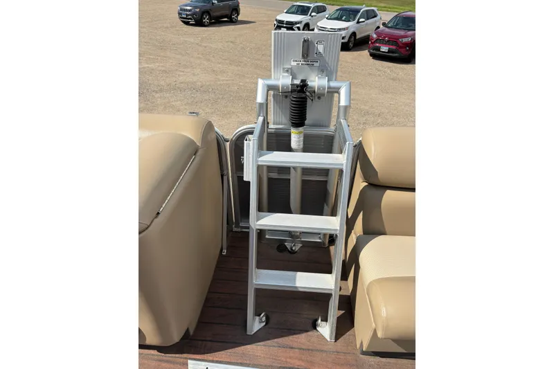 Slide: The Image of Aluminum ladder on a 2006 South Bay 23 pontoon boat with beige seating. - 17