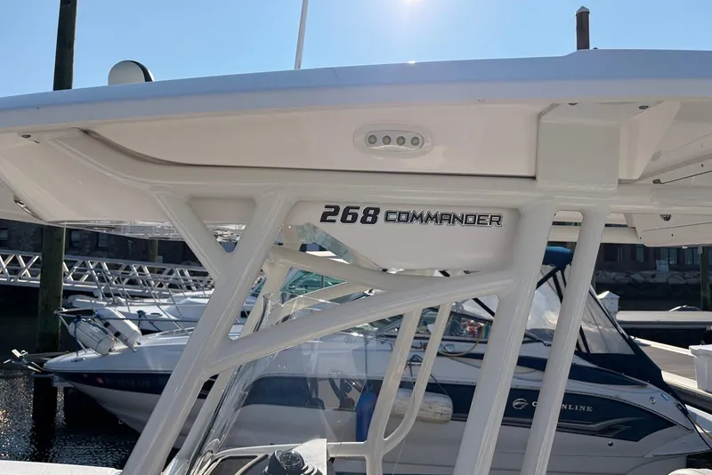Slide: The Image of 2022 Sea Fox 268 Commander boat docked, showcasing sleek design and sturdy structure. - 8