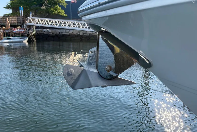 Slide: The Image of Anchor of 2022 Sea Fox 268 Commander boat in calm waters near a dock. - 6