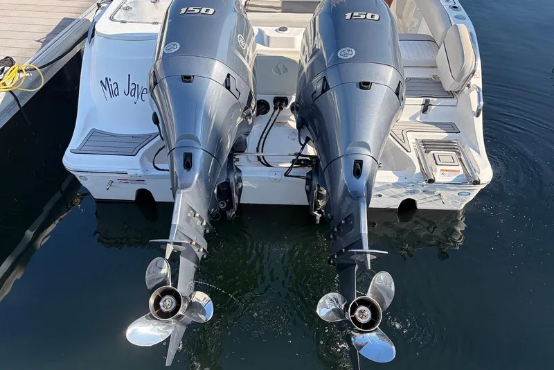 Slide: The Image of 2022 Sea Fox 268 Commander with dual 150 horsepower engines docked in water. - 3