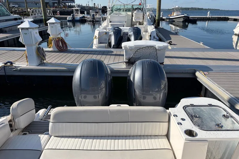 Slide: The Image of 2022 Sea Fox 268 Commander docked with dual outboard engines. - 5
