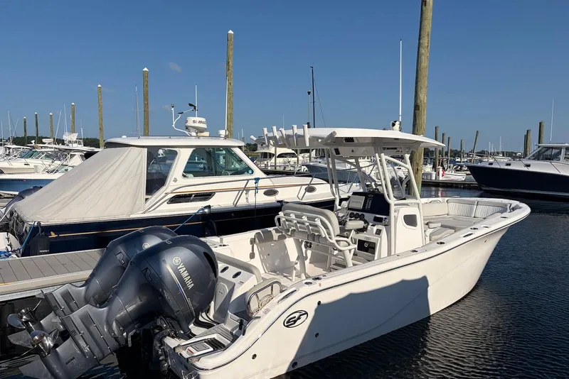 The Image of 2022 Sea Fox 268 Commander boat docked with Yamaha engines, clear sky background. - 0