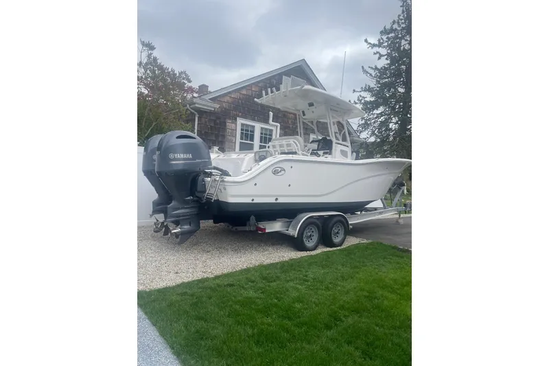 Slide: The Image of 2022 Sea Fox 268 Commander boat on trailer, parked beside a house. - 18