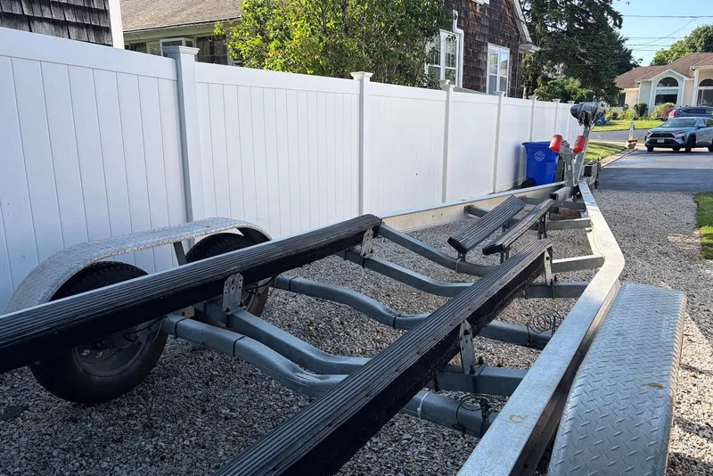 Slide: The Image of Boat trailer parked on gravel driveway, suitable for 2022 Sea Fox 268 Commander. - 22