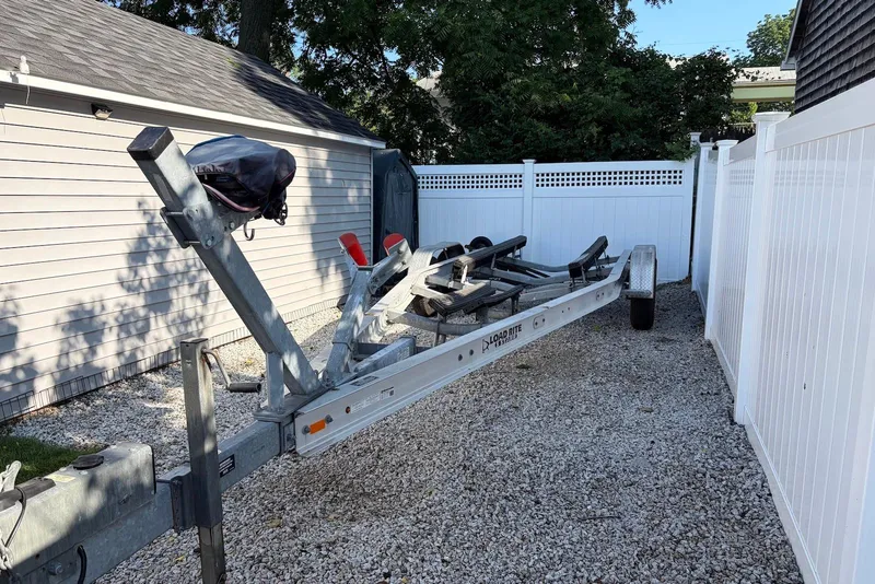 Slide: The Image of Trailer for 2022 Sea Fox 268 Commander, parked on gravel beside a white fence. - 19