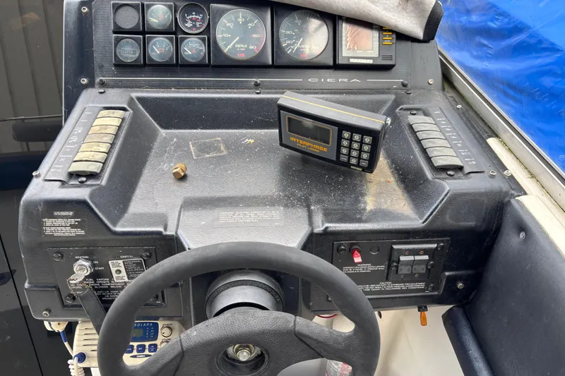 Slide: The Image of 1992 Bayliner 2850 Contessa dashboard with steering wheel and navigation instruments. - 11