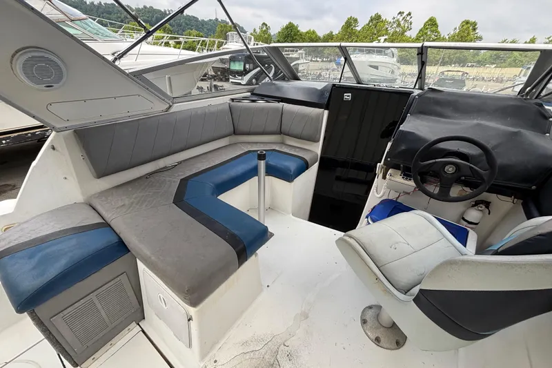 Slide: The Image of 1992 Bayliner 2850 Contessa boat interior with seating and steering wheel. - 5