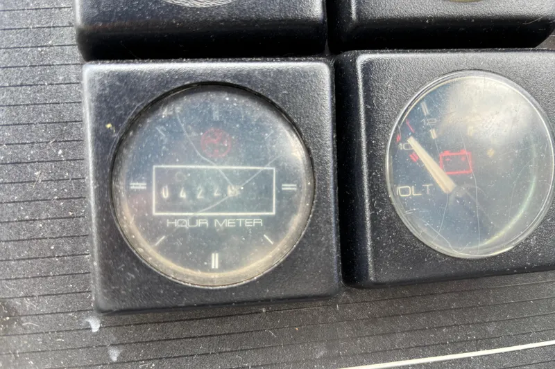 Slide: The Image of Hour and volt meters on 1992 Bayliner 2850 Contessa dashboard. - 12