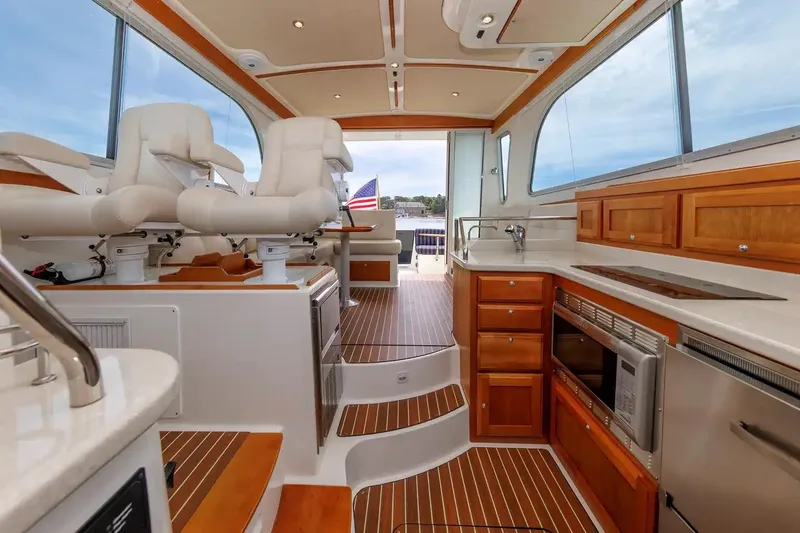 Slide: The Image of Luxurious interior of 2017 Back Cove Yachts 37 with elegant seating and modern kitchen amenities. - 33