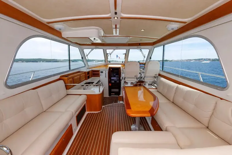 Slide: The Image of Luxurious interior of 2017 Back Cove Yachts 37 with plush seating and ocean view. - 26