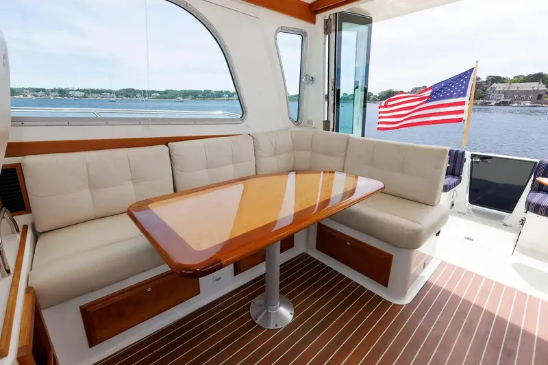 Slide: The Image of Luxurious 2017 Back Cove Yachts 37 interior with elegant seating and wooden table. - 32