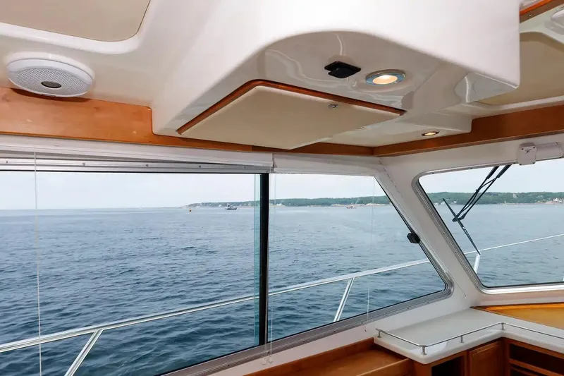 Slide: The Image of Interior view from a 2017 Back Cove Yachts 37, showcasing ocean scenery through large windows. - 44