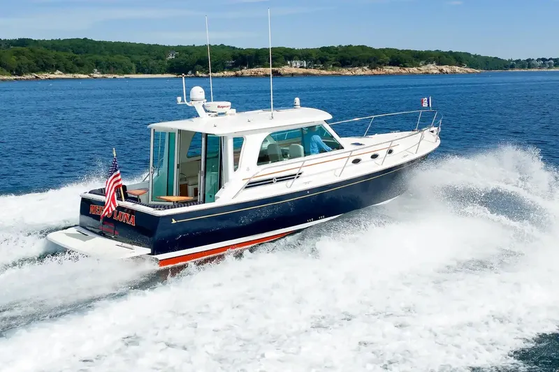 Slide: The Image of 2017 Back Cove Yachts 37 cruising on open water, displaying sleek design and powerful performance. - 2