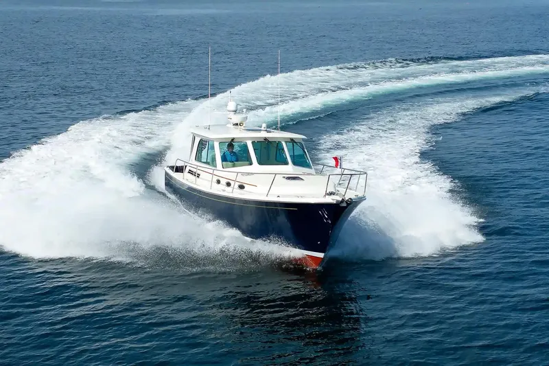 Slide: The Image of 2017 Back Cove Yachts 37 cruising swiftly on open water. - 12