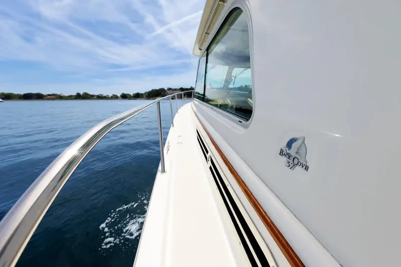 Slide: The Image of 2017 Back Cove Yachts 37 cruising on calm waters under a clear sky. - 24