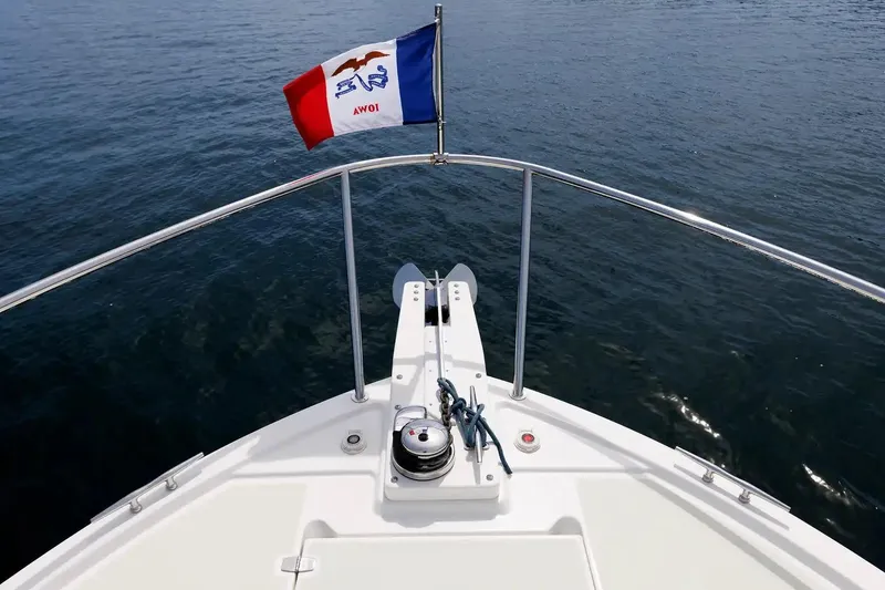 Slide: The Image of Bow view of 2017 Back Cove Yachts 37 with flag and anchor equipment. - 17