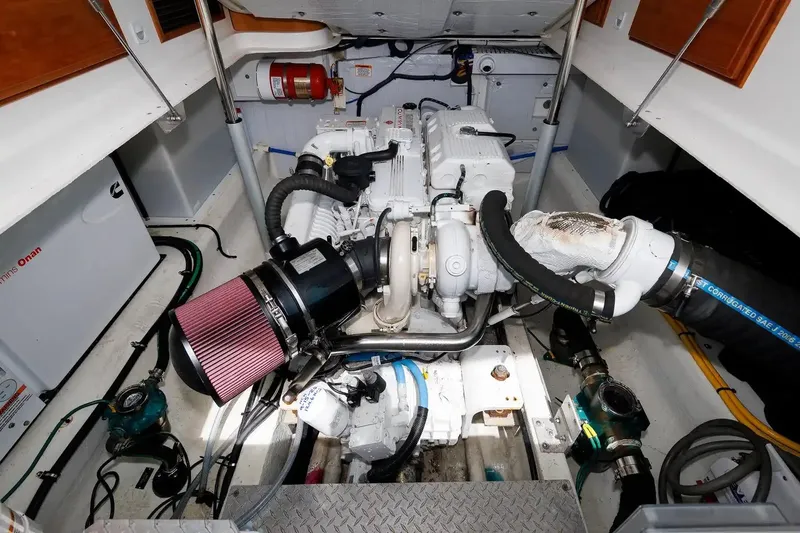 Slide: The Image of Engine room of a 2017 Back Cove Yachts 37, featuring mechanical components and equipment. - 54