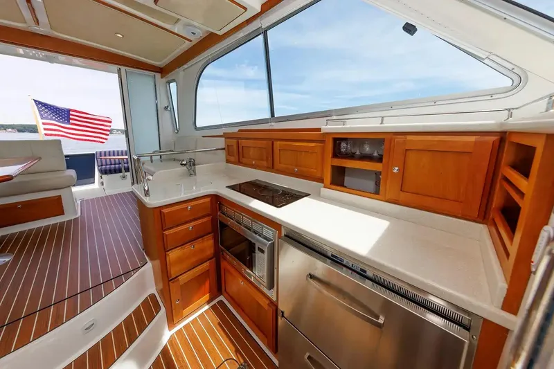 Slide: The Image of Luxurious 2017 Back Cove Yachts 37 interior with elegant wood cabinetry and modern appliances. - 43