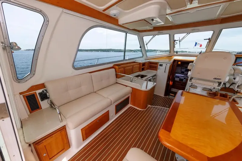 Slide: The Image of Interior of 2017 Back Cove Yachts 37, featuring elegant wood finishes and comfortable seating. - 27