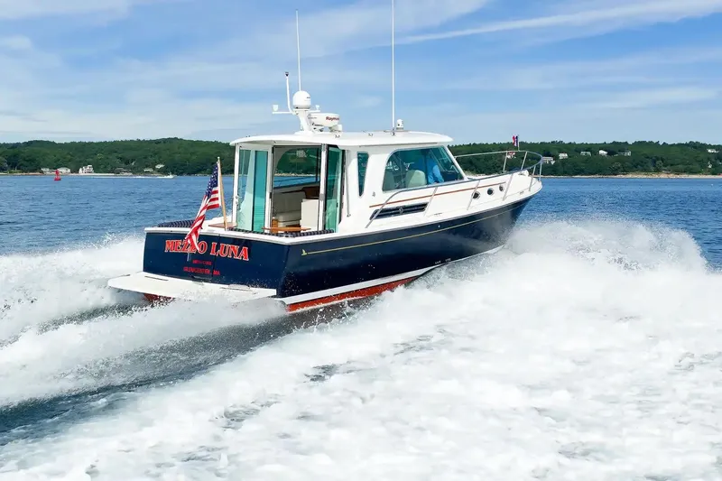 Slide: The Image of 2017 Back Cove Yachts 37 cruising on open water, showcasing sleek design and powerful performance. - 14