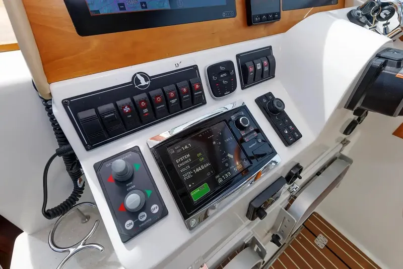 Slide: The Image of Control panel of a 2017 Back Cove Yachts 37, featuring navigation and system controls. - 37