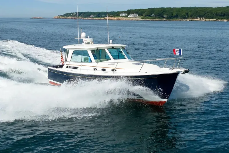 Slide: The Image of 2017 Back Cove Yachts 37 cruising on open water, showcasing sleek design and performance. - 13