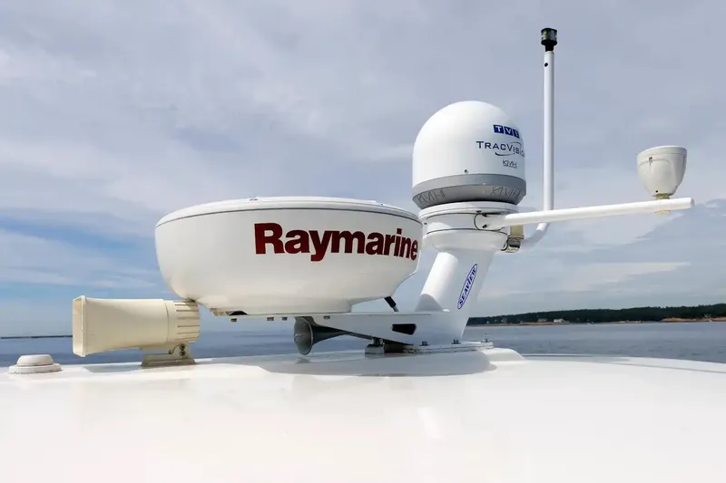 Slide: The Image of Radar and satellite equipment on a 2017 Back Cove Yachts 37, featuring Raymarine and TracVision systems. - 16