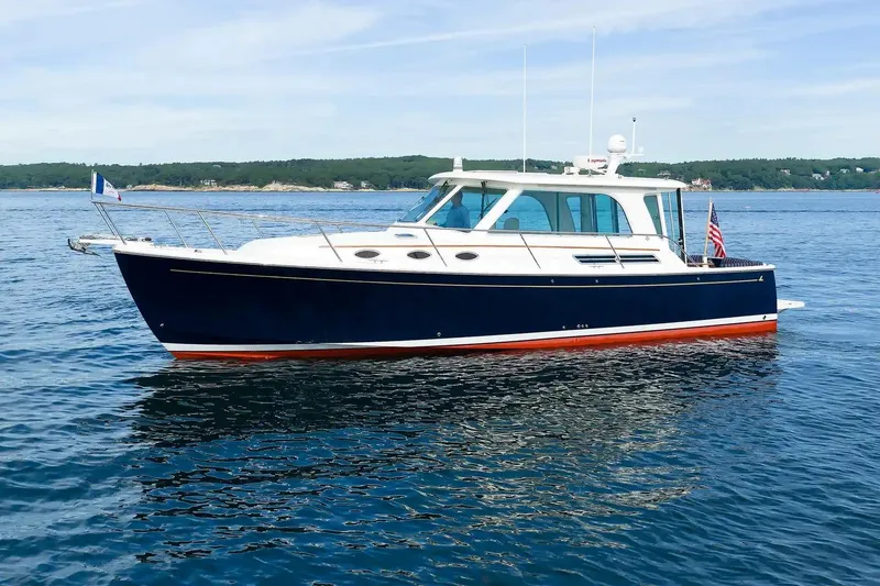 Slide: The Image of 2017 Back Cove Yachts 37 cruising on calm blue waters. - 6