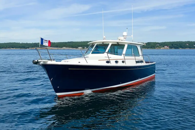 Slide: The Image of 2017 Back Cove Yachts 37 cruising on calm blue waters. - 3