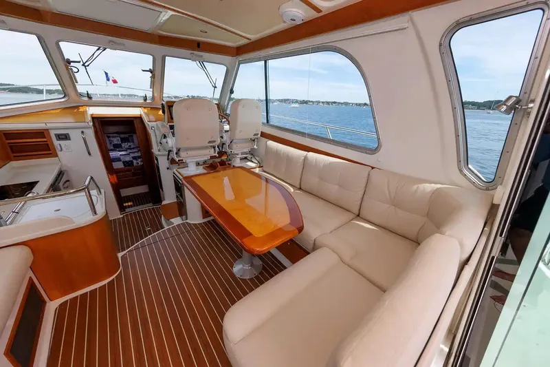 Slide: The Image of Luxurious interior of 2017 Back Cove Yachts 37 with elegant seating and scenic ocean view. - 29