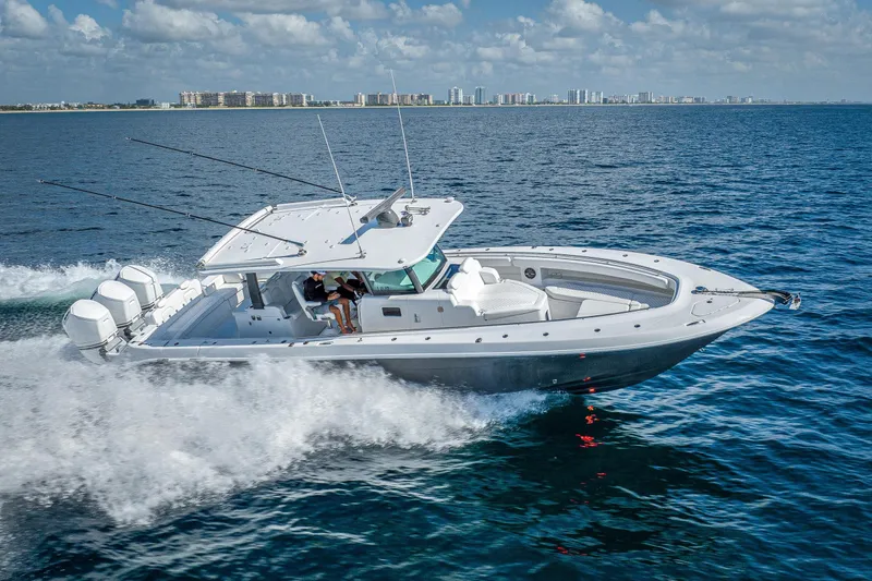 The Image of 2027 HCB 42 Lujo boat cruising on open water under a clear sky. - 1