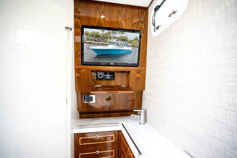 Slide: The Image of Luxurious interior of 2027 HCB 42 Lujo yacht with wood paneling and modern amenities. - 3