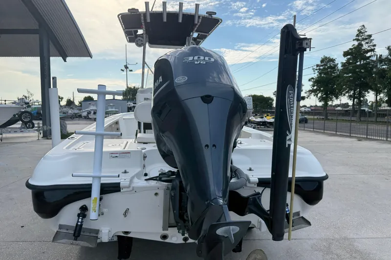 Slide: The Image of 2008 Triton 240 LTS boat with Yamaha 300 HP engine, docked outdoors. - 11