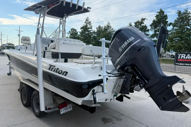 Slide: The Image of 2008 Triton 240 LTS boat with Yamaha outboard motor on trailer. - 10
