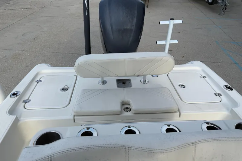 Slide: The Image of 2008 Triton 240 LTS boat interior with seating and storage compartments. - 19