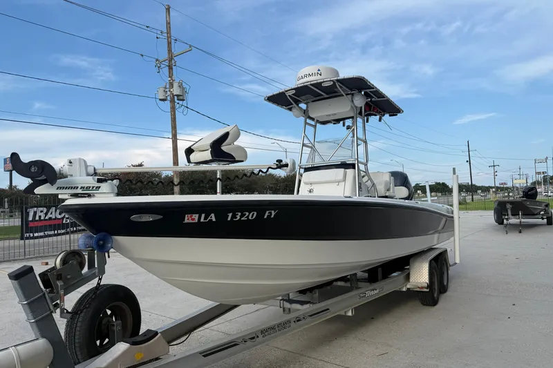 Slide: The Image of 2008 Triton 240 LTS boat on trailer, equipped with Garmin and Minn Kota accessories. - 5