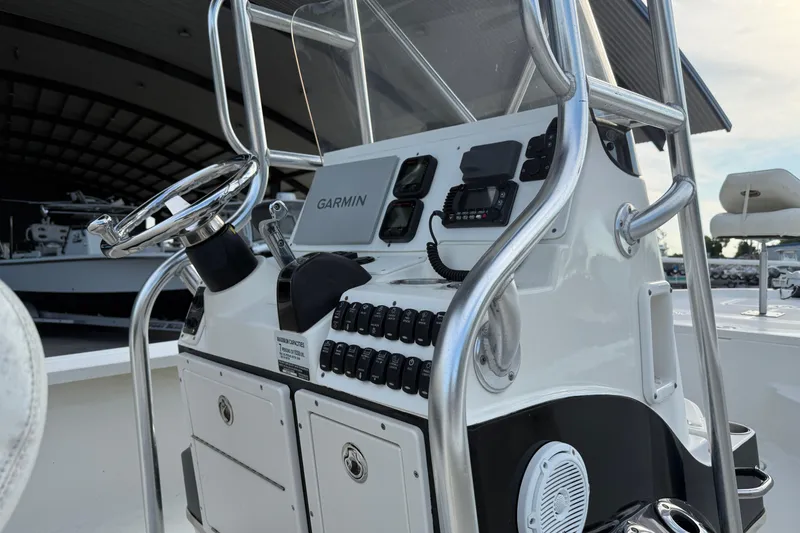 Slide: The Image of 2008 Triton 240 LTS boat console with Garmin navigation system and steering wheel. - 13