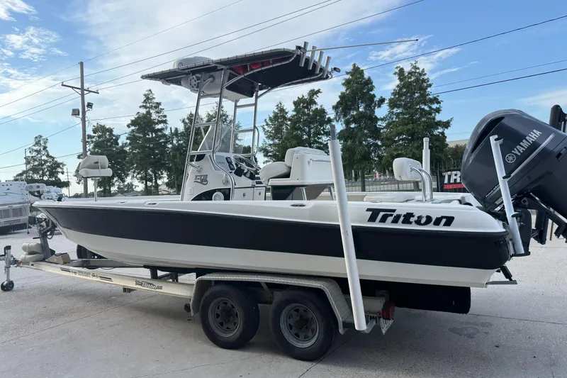 Slide: The Image of 2008 Triton 240 LTS boat on trailer with Yamaha outboard motor. - 9