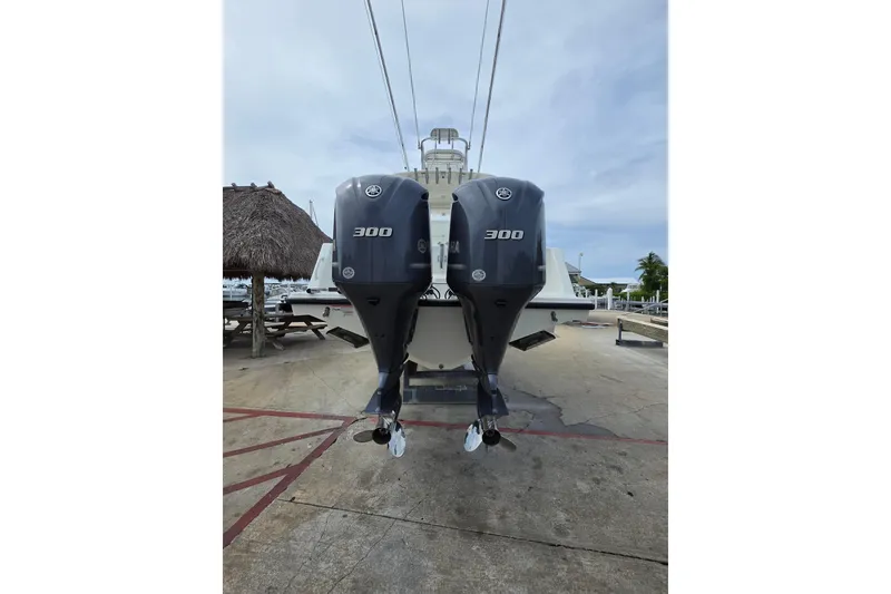 Slide: The Image of 2016 SeaVee 320B boat with dual Yamaha 300 outboard engines at dockside. - 2