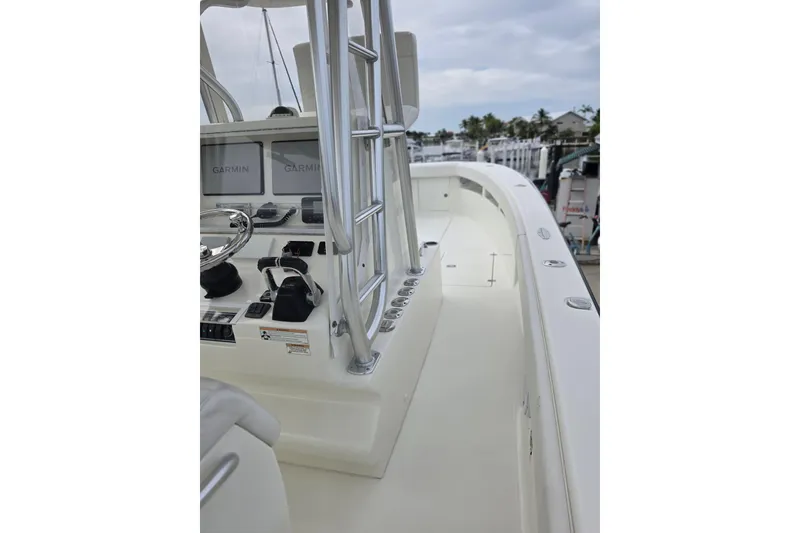 Slide: The Image of 2016 SeaVee 320B boat interior with Garmin navigation, sleek design, and spacious deck. - 14