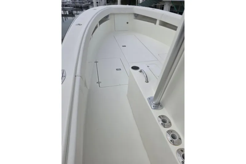 Slide: The Image of 2016 SeaVee 320B boat deck with rod holders and storage compartments. - 8