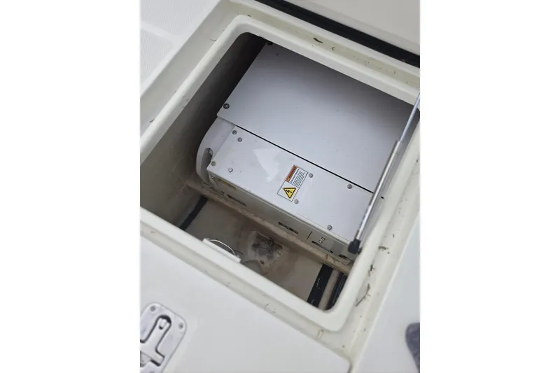 Slide: The Image of Storage compartment of a 2016 SeaVee 320B boat, featuring a secured electronic device. - 5
