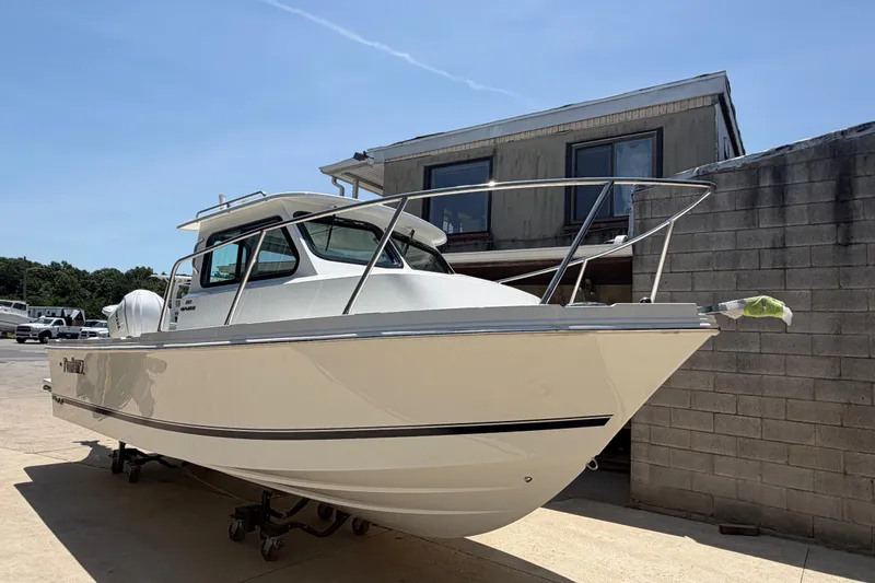 The Image of 2027 Parker 227 Explorer boat parked outdoors on a sunny day. - 1