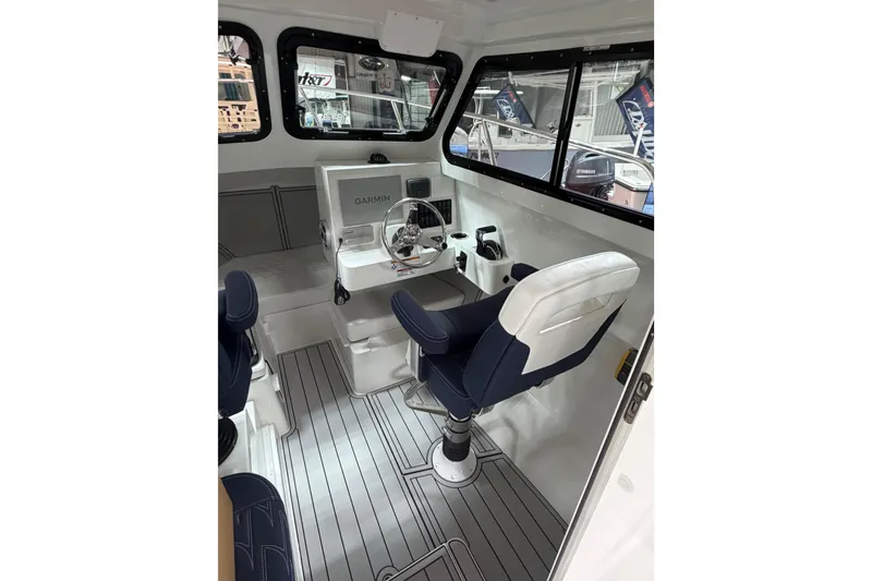 Slide: The Image of Interior of 2027 Parker 227 Explorer boat with modern helm and seating. - 10